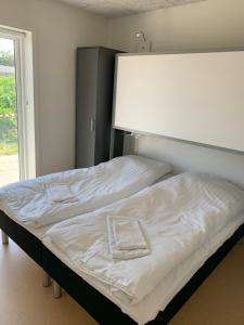 Postel nebo postele na pokoji v ubytování Den Gode Søvn