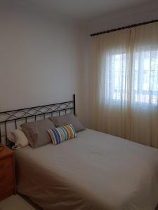 Posteľ alebo postele v izbe v ubytovaní Apartamento Antonio Machado