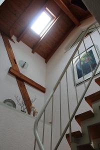 a stairway with a skylight in a house at Bed & Breakfast Bodensee mit Herz in Stockach