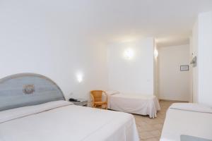 Postelja oz. postelje v sobi nastanitve Hotel Angedras