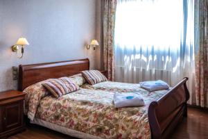 Postel nebo postele na pokoji v ubytování Duna Relax Hotel Ráckeve
