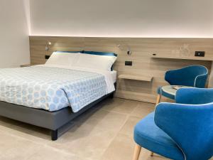 Postel nebo postele na pokoji v ubytování Hotel Locanda Alla Perla