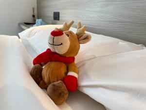 Postel nebo postele na pokoji v ubytování Hotel Locanda Alla Perla