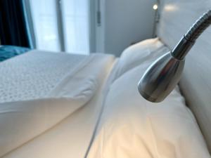 Postel nebo postele na pokoji v ubytování Hotel Locanda Alla Perla