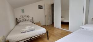Posteľ alebo postele v izbe v ubytovaní Apartment Sunce