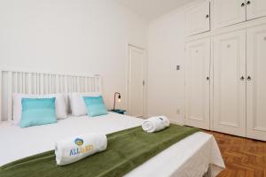 A bed or beds in a room at Adorável em Ipanema - Perto da praia - PM402 Z1