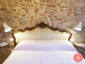 Posteľ alebo postele v izbe v ubytovaní Casa Raffaella 2 Tuscan charm in medieval Suvereto