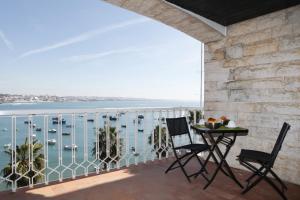 a balcony with a view of the water and boats at Remarkable view over Cascais Bay in Cascais