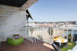 a balcony with a view of the ocean at Remarkable view over Cascais Bay in Cascais +25 photos