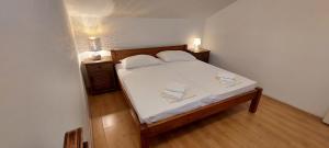 Posteľ alebo postele v izbe v ubytovaní Apartment Sunce