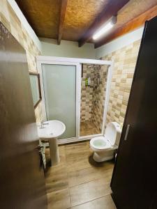 a bathroom with a toilet and a sink at Lovely house not far from the beach, near Protaras in Dherinia