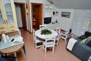 Televízia a/alebo spoločenská miestnosť v ubytovaní Apartamento de Pilar - 7000