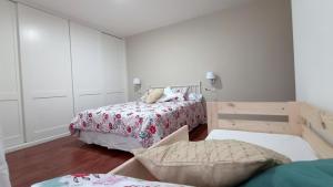 Posteľ alebo postele v izbe v ubytovaní O Lagar apartamento grande y luminoso. 8 personas.
