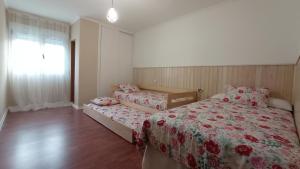 Posteľ alebo postele v izbe v ubytovaní O Lagar apartamento grande y luminoso. 8 personas.