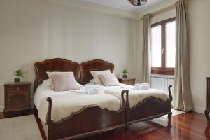 Posteľ alebo postele v izbe v ubytovaní Zinema - Basque Stay