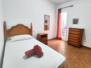 A bed or beds in a room at La Chalana