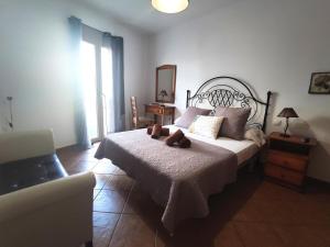 A bed or beds in a room at La Chalana
