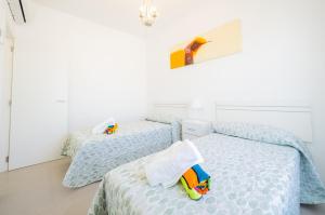 Posteľ alebo postele v izbe v ubytovaní Cubo's Villa Pilar