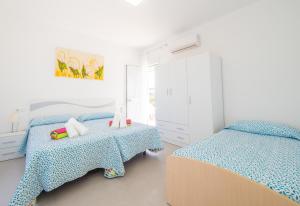 Posteľ alebo postele v izbe v ubytovaní Cubo's Villa Pilar