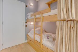 a bunk bed room with a couple of bunk beds at Atray Studio - Snow and Trek in Morzine