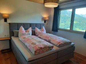 Llit o llits en una habitació de Panoramahof Bergglück