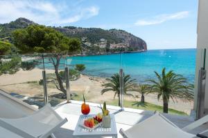 a view of the beach from the balcony of a house at Melbeach Hotel & Spa - Adults Only in Canyamel