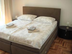 Postel nebo postele na pokoji v ubytování Apartment Ivan J Selce