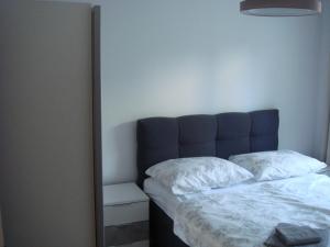 Postel nebo postele na pokoji v ubytování Apartment Ivan J Selce