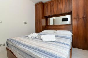 Posteľ alebo postele v izbe v ubytovaní My Desenzano Holiday Apartment