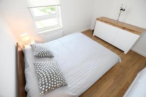 Posteľ alebo postele v izbe v ubytovaní Apartament Słoneczny przy Rybackiej