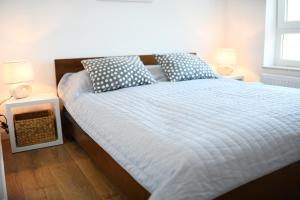 Posteľ alebo postele v izbe v ubytovaní Apartament Słoneczny przy Rybackiej