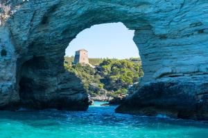 a bridge over a river with a castle in the background at Casa Colletta Vieste in Vieste +9 photos