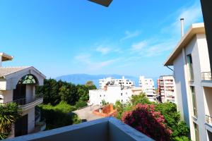 a view of the city from the balcony of a building at HOTEL KRISTAL in Vlorë