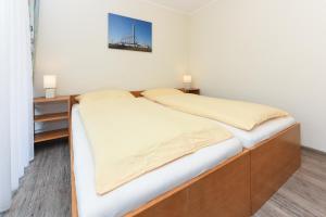 Postel nebo postele na pokoji v ubytování Ferienwohnung An Bord