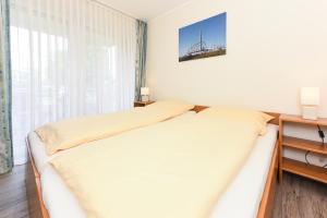 Postel nebo postele na pokoji v ubytování Ferienwohnung An Bord