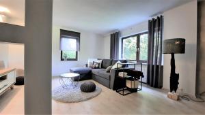 Posezení v ubytování Ferienwohnung Königsquellenpark + 24 fotografií