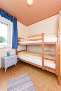Postel nebo postele na pokoji v ubytování Ferienwohnung An Bord
