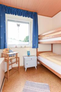 Postel nebo postele na pokoji v ubytování Ferienwohnung An Bord