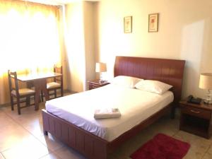 Uma cama ou camas num quarto em Hotel Onix Gold