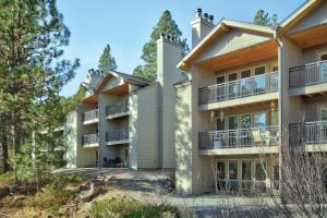 an exterior view of a building with trees at Seventh Mountain Resort in Bend