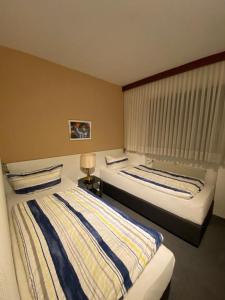 Postel nebo postele na pokoji v ubytování Hotel -Pension-Weller