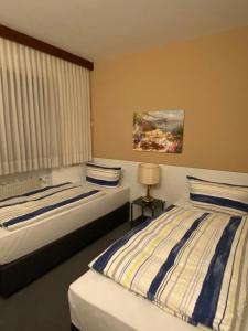 Postel nebo postele na pokoji v ubytování Hotel -Pension-Weller