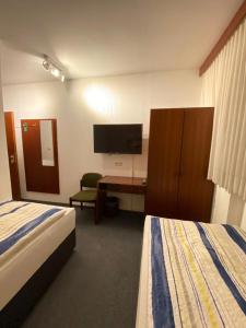 Postel nebo postele na pokoji v ubytování Hotel -Pension-Weller