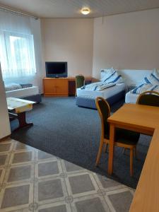 Posezení v ubytování Hotel -Pension-Weller
