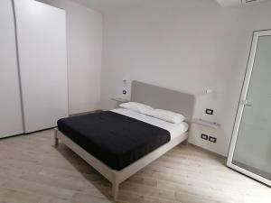 Posteľ alebo postele v izbe v ubytovaní Vasto in centro
