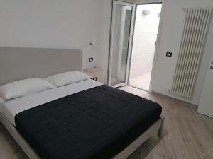 Posteľ alebo postele v izbe v ubytovaní Vasto in centro