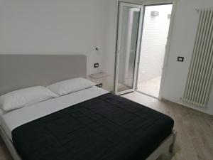 Posteľ alebo postele v izbe v ubytovaní Vasto in centro