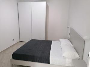 Posteľ alebo postele v izbe v ubytovaní Vasto in centro