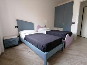 Posteľ alebo postele v izbe v ubytovaní Vasto in centro
