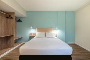 Postel nebo postele na pokoji v ubytování B&B HOTEL Rio Copacabana Posto 5